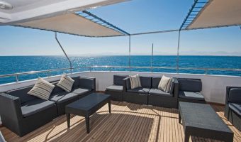 sun covering eating area of Teak flooring yacht