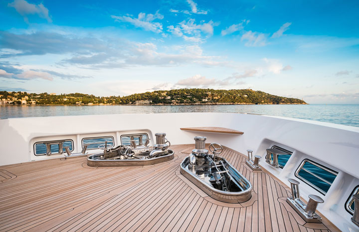 front of yacht with teak deck cruising into beautiful sea
